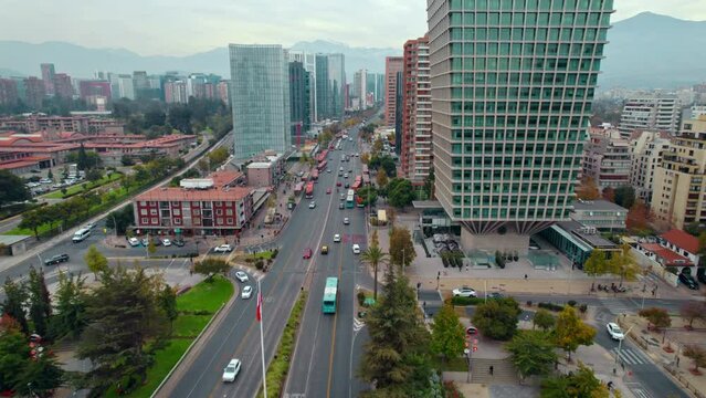 Aerial Drone Fast tracks traffic at Santiago de chile vibrant capital SCL building Apoquindo avenue at Escuela Militar neighborhood