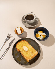 Roti Bakar is a typical grilled Indonesian sandwich, consisting of two slices of bread served with eggs and coffee