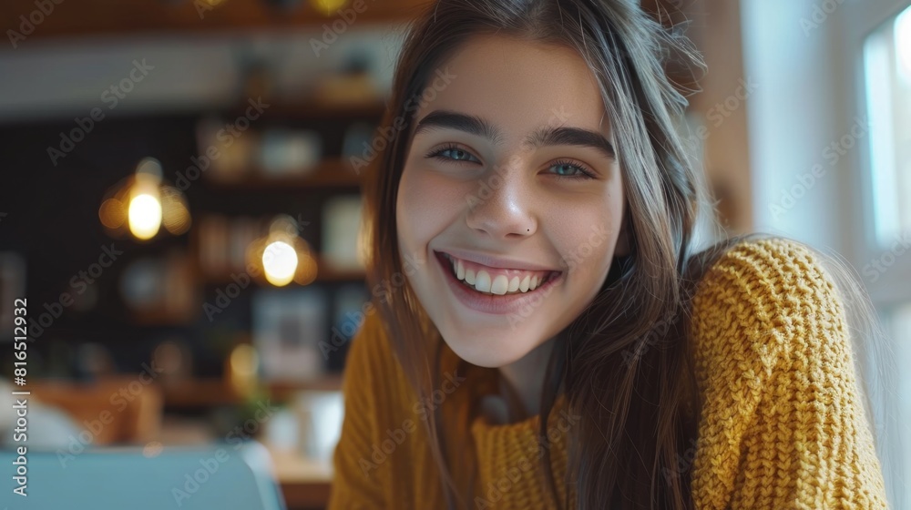 Poster young woman smiling while using a laptop. suitable for technology concepts
