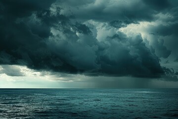 a very dark and stormy sky over the ocean