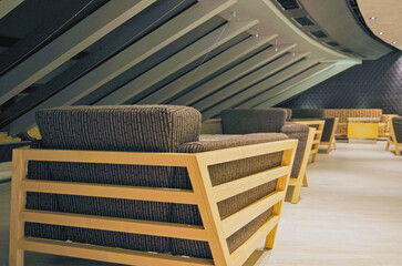 Thermal suite with heated loungers in mosaic tile design or relaxation chairs in spa or wellness...