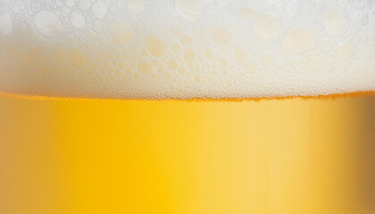 Closeup of beer with bubbles and foam in glass