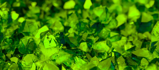 Green crystal mineral stone. Gems. Mineral crystals in the natural environment. Texture of precious...