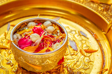 Pour water on the hands of revered elders and ask for blessing in Songkran Day.