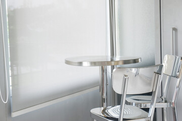 Aluminum chair and table in restaurant,Contemporary interior design of light spacious dinning room,modern furniture in living room or office,copy space.
