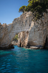 Vertical Stony Arch with Turquoise Ionian Sea in Greece. European Summer Landscape of Keri Caves in Zakynthos.