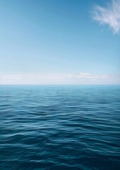Obraz premium A serene ocean horizon with the sky blending into calm waters