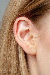 Close Up of Young Blonde Womans Ear