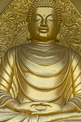 golden colored statue of lord Buddha engraved in a monastery in darjeeling in india