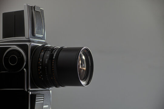 &Eacute;vora, Portugal. May 15, 2010.A Hasselblad camera, iconic in its design, rests elegantly against a sleek gray backdrop, embodying sophistication and creativity.