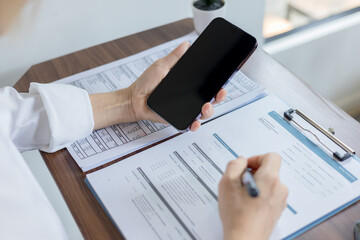 Woman is checking credit card bill information