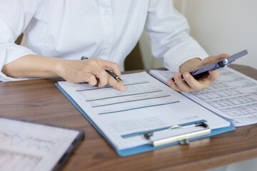 Woman is checking credit card bill information