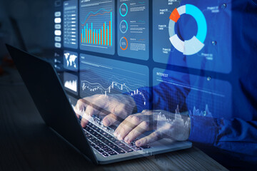 Analyst working with Financial Report and Business Analytics Dashboard on laptop computer to analyze Financial Data with KPI and Metrics. Investment, Operations, Sales, Corporate Finance, Strategy.