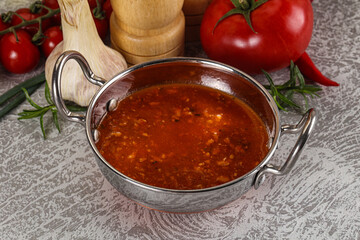 Hot tomato soup with diced chicken
