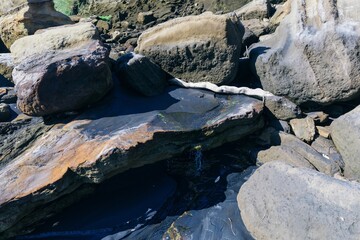 Freshwater spring rock pools at the beach, Awhitu, Waiuku, Auckland, New Zealand.