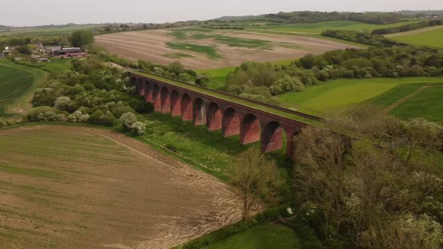 An aerial view of the Ledbury Viaduct bridge in England during daylight
