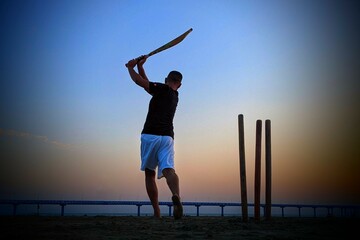 Silhouette of a person playing on the beach