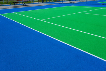 Fototapeta premium Part of the synthetic grass tennis court with markup