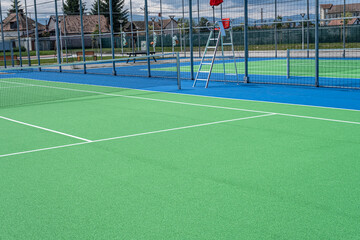 Part of the synthetic grass tennis court with markup
