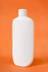 Shampoo bottle on orange