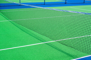 Part of the synthetic grass tennis court with markup