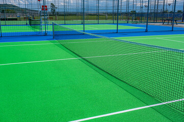 Part of the synthetic grass tennis court with markup