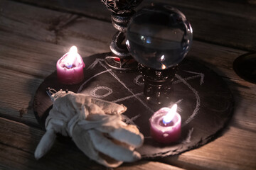 Mysterious Occult Ritual Setup with Crystal Ball and Candles.