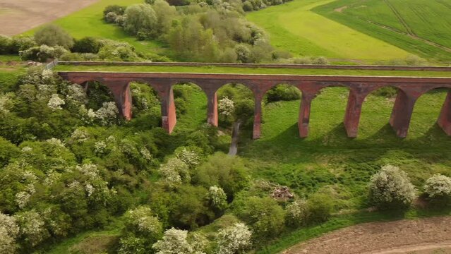 An aerial view of the Ledbury Viaduct bridge in England during daylight