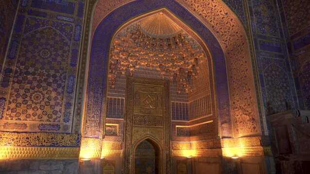 Inside view of the Tilya-Kori Mosque (Tilla-Kari) at the Registan Square. The Registan is a popular tourist attraction of Asia. Samarkand, Uzbekistan