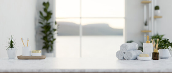 A luxury white marble tabletop features toiletries and a copy space in a modern white bathroom.