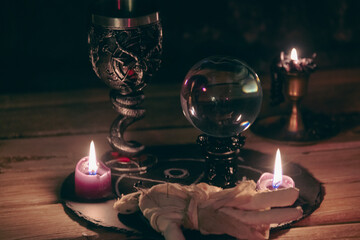Mysterious Occult Ritual Setup with Crystal Ball and Candles.