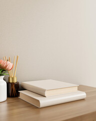 White books, a flower vase, and a reed diffuser on a wooden table against the white wall in a room.