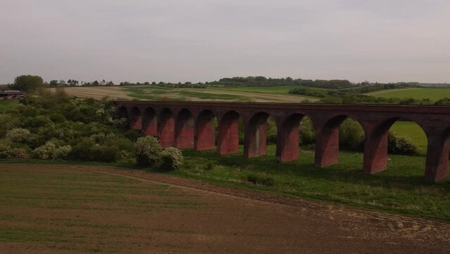 An aerial view of the Ledbury Viaduct bridge in England during daylight