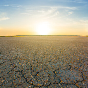 dry cracked earch at the sunset