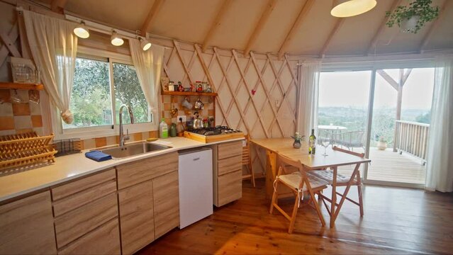 Interior of a kitchen in a fancy wooden Yurt tent
