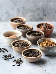 assortment of dry tea in ceramic bowls 