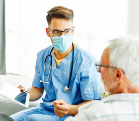 nurse doctor senior care caregiver help assistence retirement home tablet computer virus mask corona