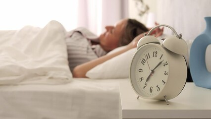 Woman leisurely stretches on bed after awakening. Start your day right with our refreshing morning routine. Embrace tranquility of awakening to new day. Energize yourself with positivity of awakening