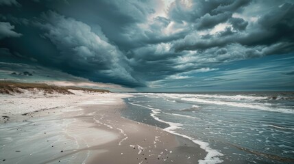 A sandy beach with wind waves crashing against the shore under a stormy sky filled with cumulus clouds, creating a dramatic natural landscape AIG50