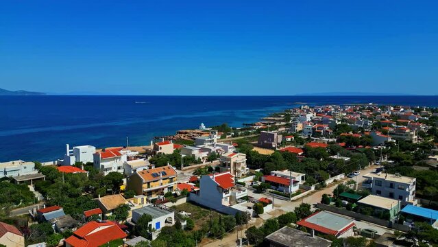 St. Paraskevi Church And The Aegean Sea In Artemida, Greece. - aerial shot