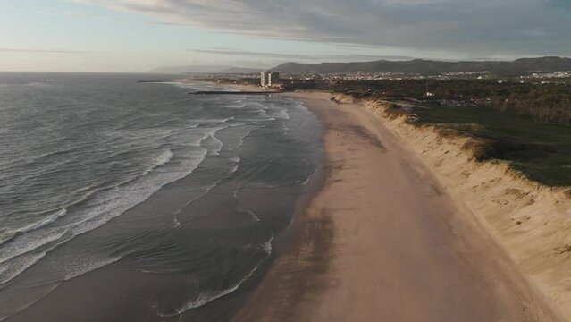 wide aerial view of Ofir Beach in Esposende, Portugal, with sand dunes and ocean waves
