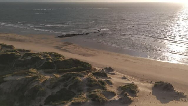 Sunset aerial view of Ofir Beach with sand dunes and ocean in Esposende, Portugal