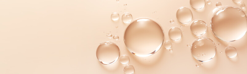 round drops of transparent gel serum on pastel beige background