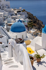 Whitewashed buildings on the edge of the caldera cliff in Oia village, Santorini, Greece