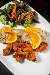 Savory Portuguese dish: Migas with crispy fried pork, a traditional comfort food. Perfect blend of flavors and textures.