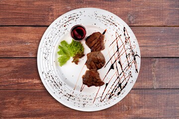 Traditional roast meat on white plate