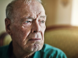 Elderly, man and thinking with depression for memory in retirement home with remember, nostalgia or...