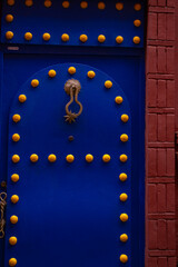 entrance wooden old carved doors Morocco in oriental style, traditional oriental shades, ornate...