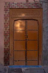 entrance wooden old carved doors Morocco in oriental style, traditional oriental shades, ornate...