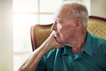 Elderly, man and depression with thinking of memory in retirement home with remember, nostalgia or...